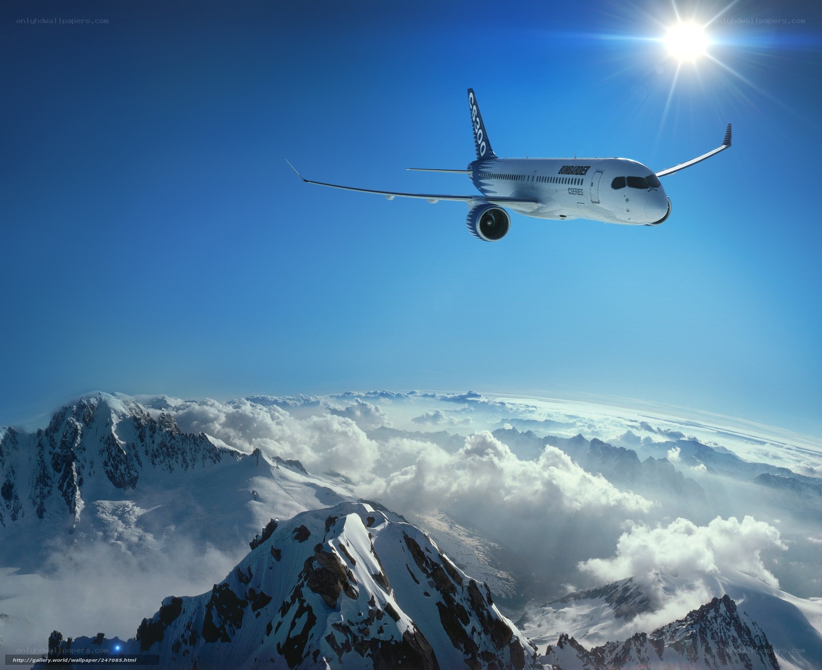 Airplane flying over snowy mountains