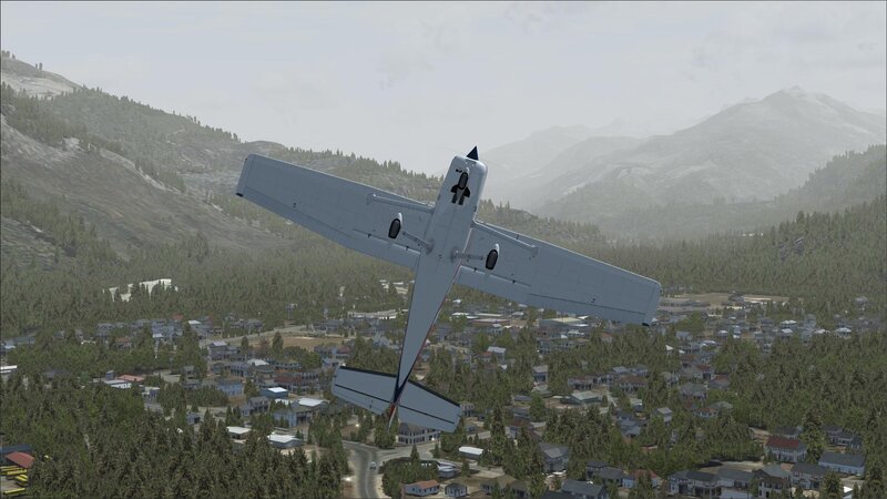 airplane flying over town
