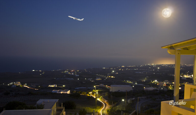 Airplane Flying over Town — Blue