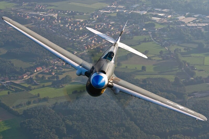 Airplane Flying over Town — Green