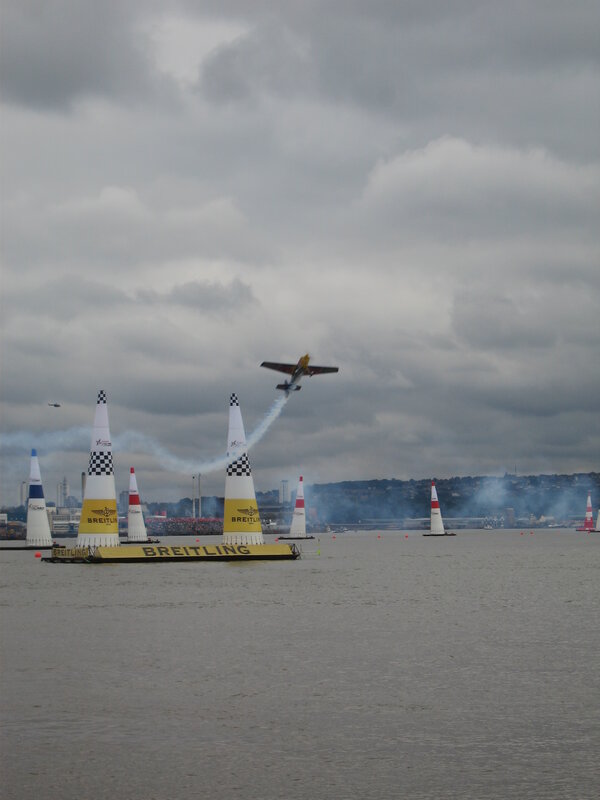 Airplane flying over water course
