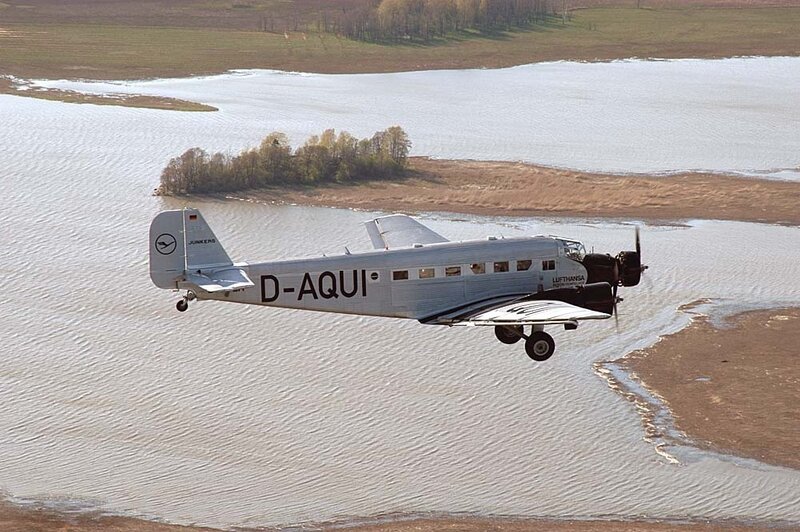 Airplane Flying over Water