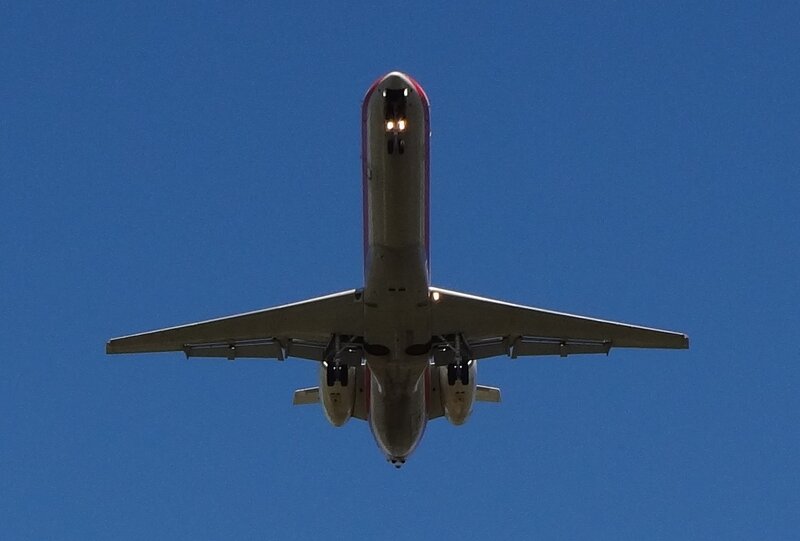 Airplane Flying Overhead — Blue, Clear, Afternoon, Photograph
