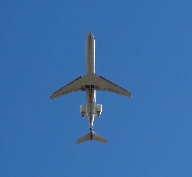 Airplane Flying Overhead — Blue, Clear, Afternoon