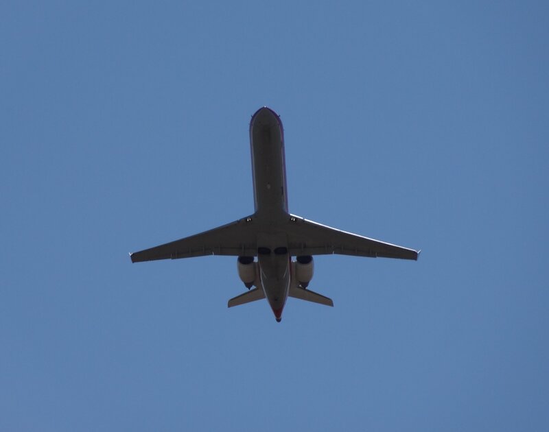 Airplane Flying Overhead — Blue, Clear