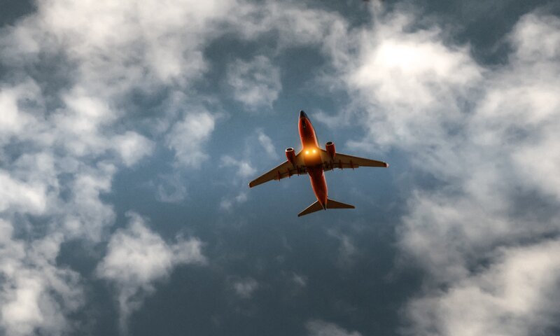 Airplane Flying Overhead — Blue, Dramatic, Afternoon, Photograph, Clouds, Sky