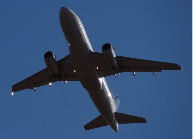Airplane Flying Overhead — Blue, Dramatic, Afternoon