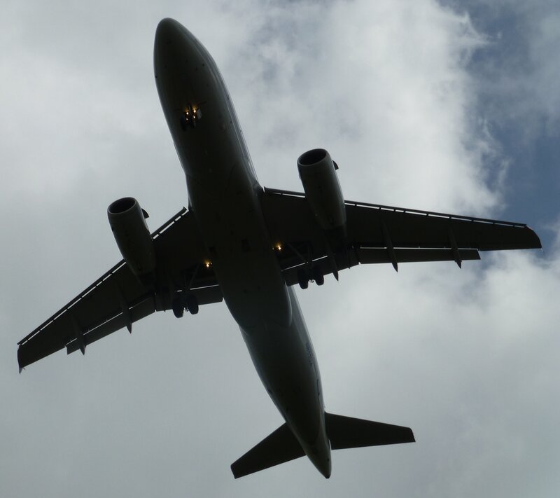 Airplane Flying Overhead — Gray, Dramatic