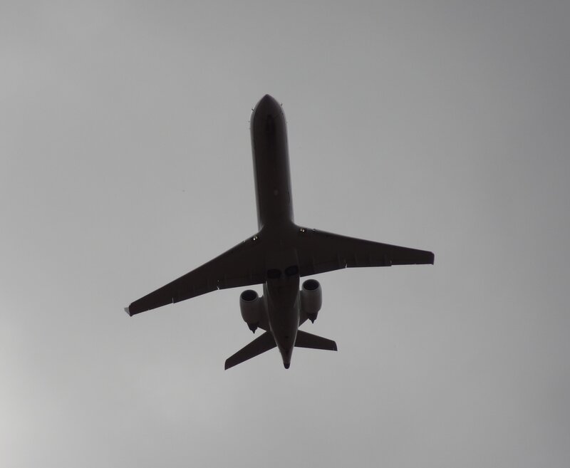 Airplane Flying Overhead — Gray