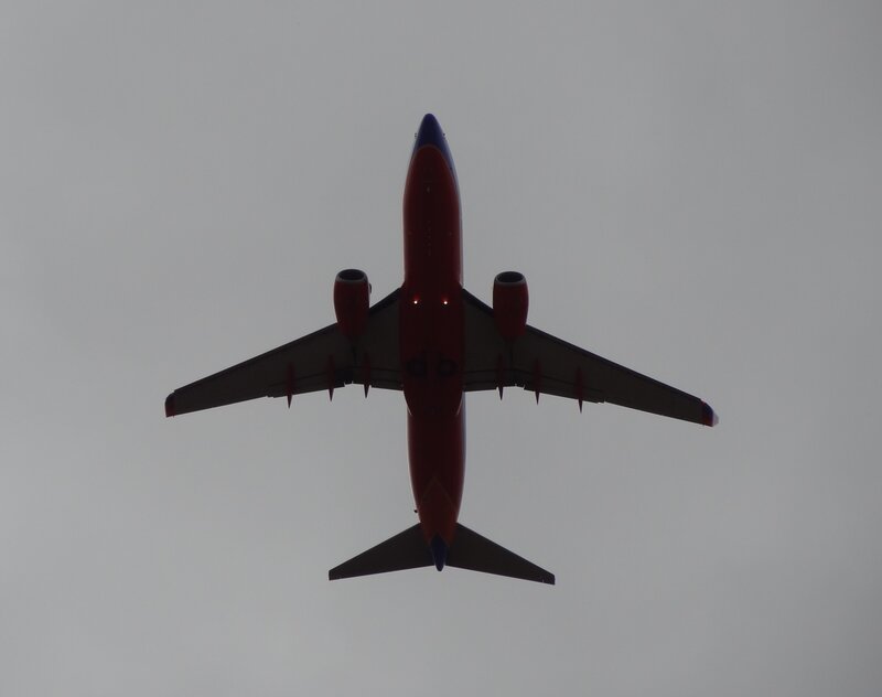 Airplane Flying Overhead — Red
