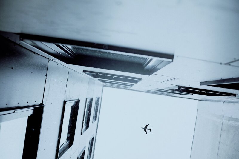 Airplane Flying Overhead — White, Dramatic