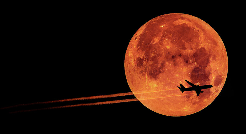 Airplane Flying Past Moon