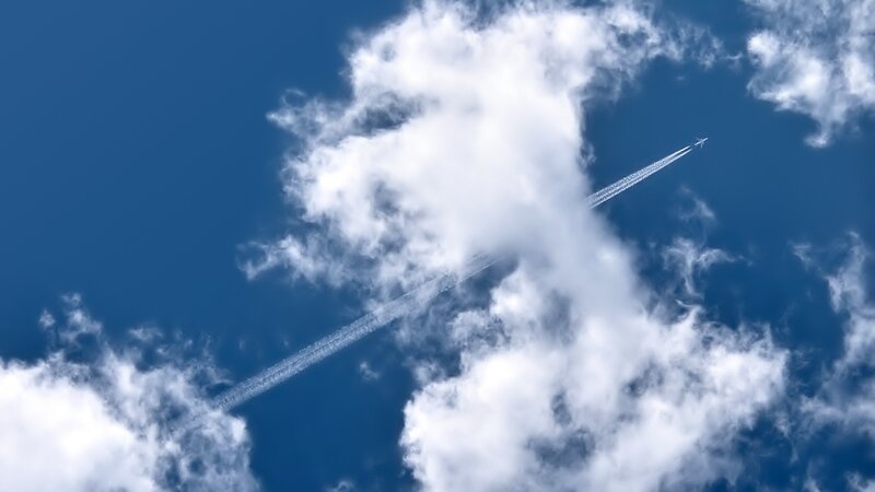 Airplane flying through clouds
