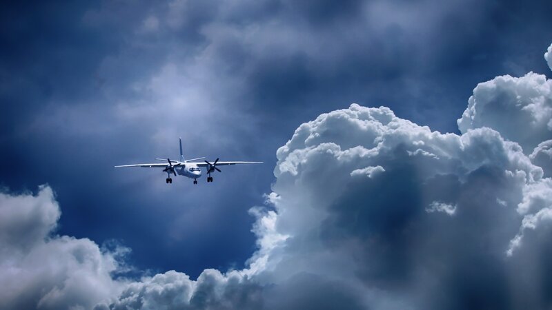 Airplane flying through clouds