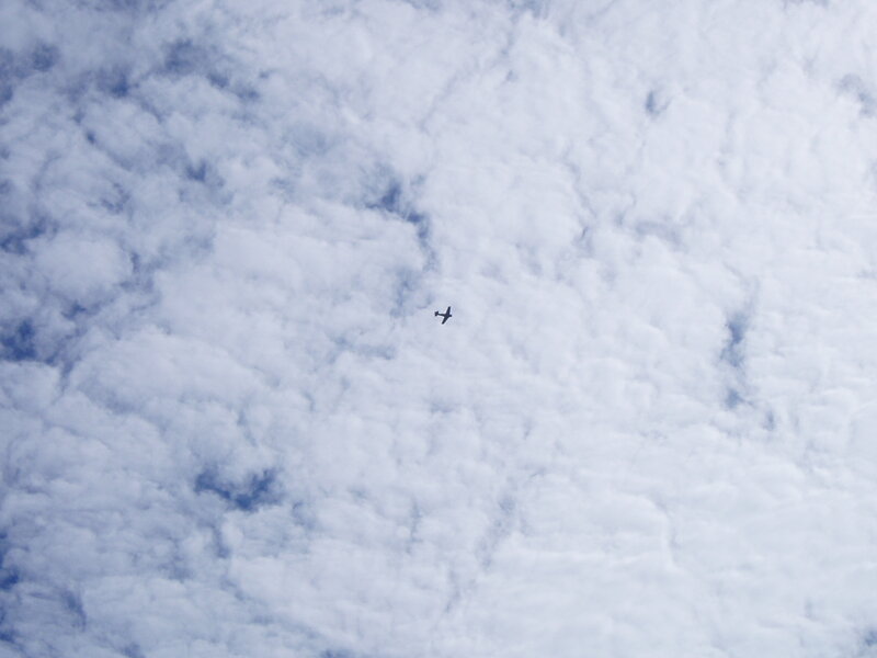 Airplane flying through clouds