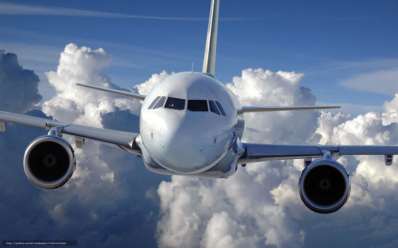 Airplane Flying Through Clouds — Blue, Dramatic, Afternoon