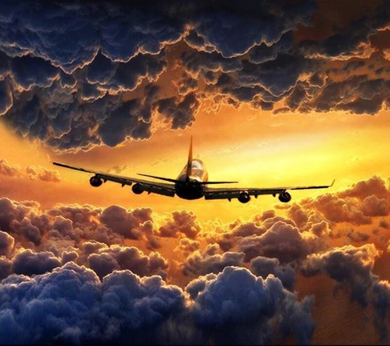 Airplane Flying Through Clouds — Orange, Dramatic