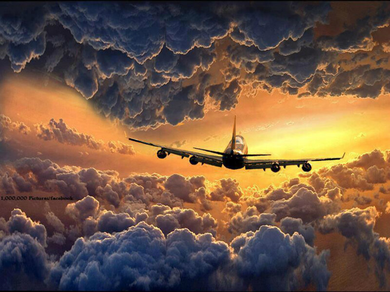 Airplane Flying Through Clouds — Orange