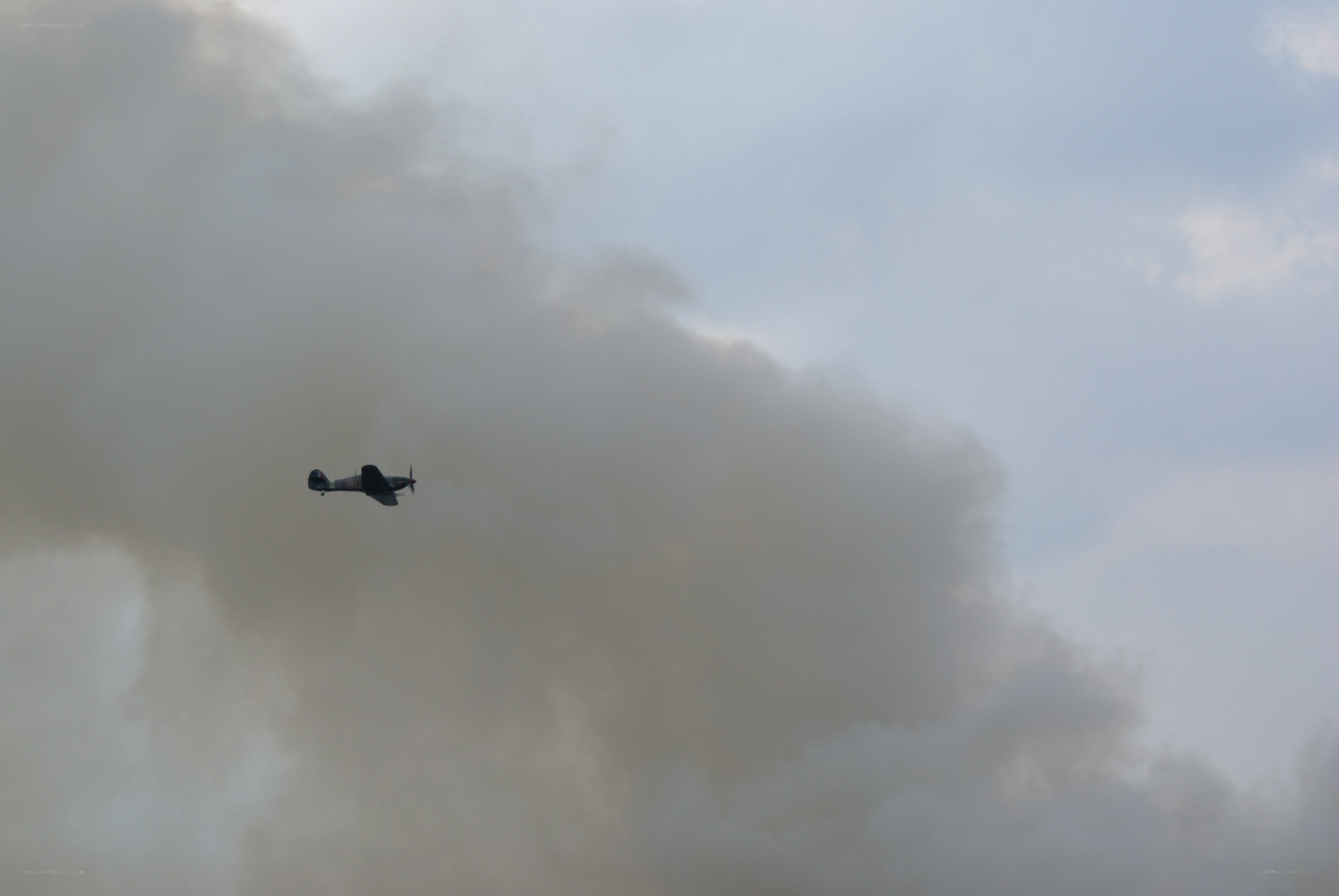 airplane flying through smoke