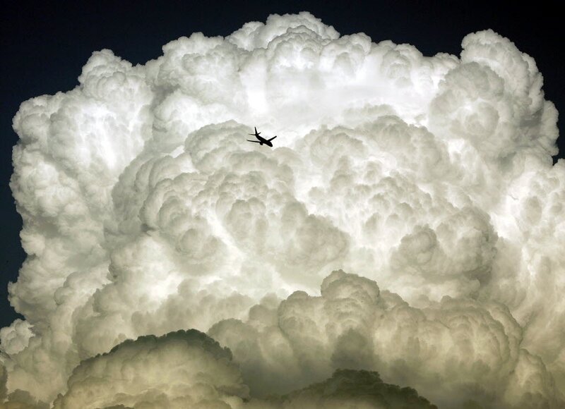 Airplane flying through storm cloud