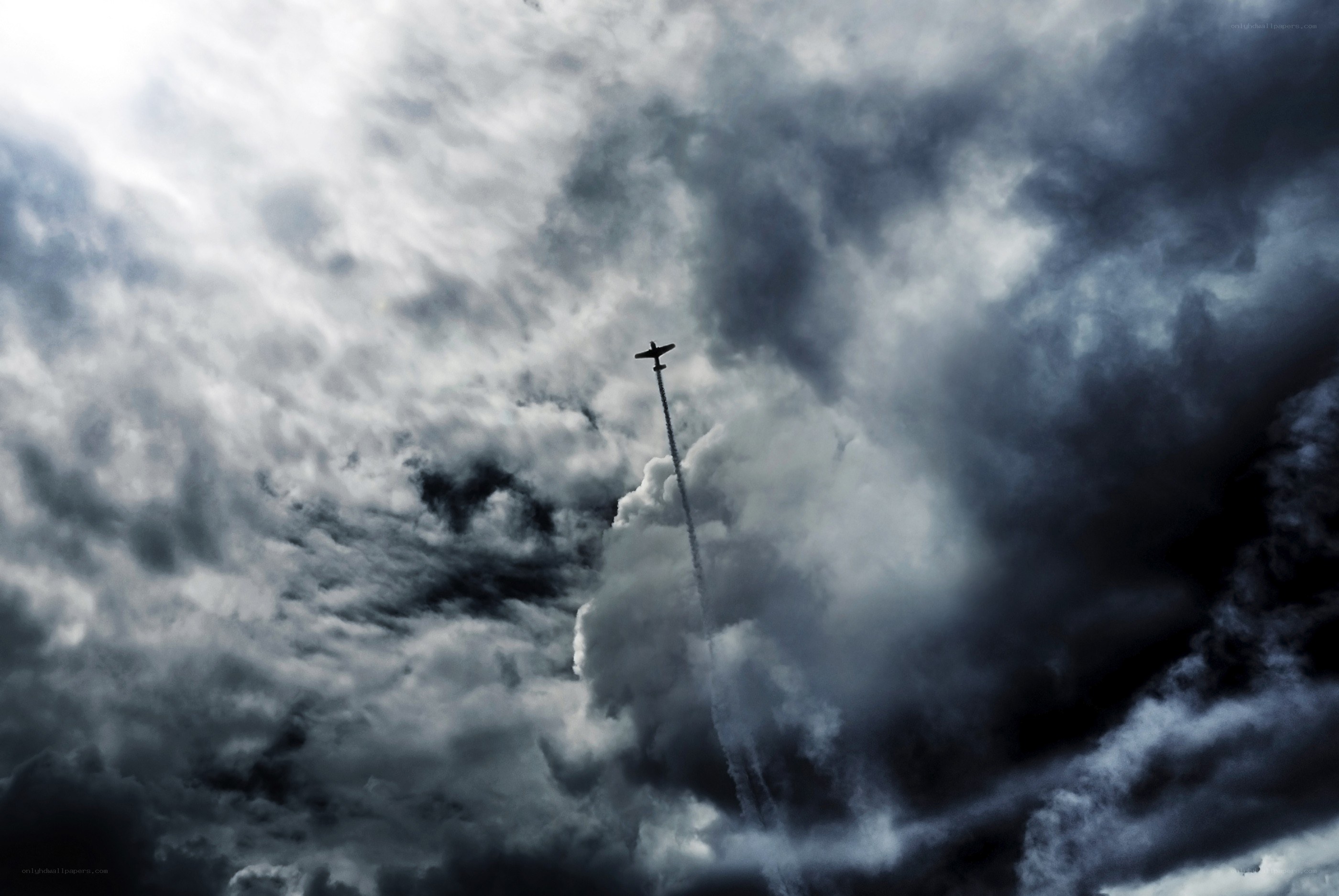 Airplane flying through storm clouds