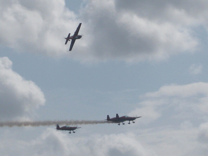 airplane formation in cloudy sky
