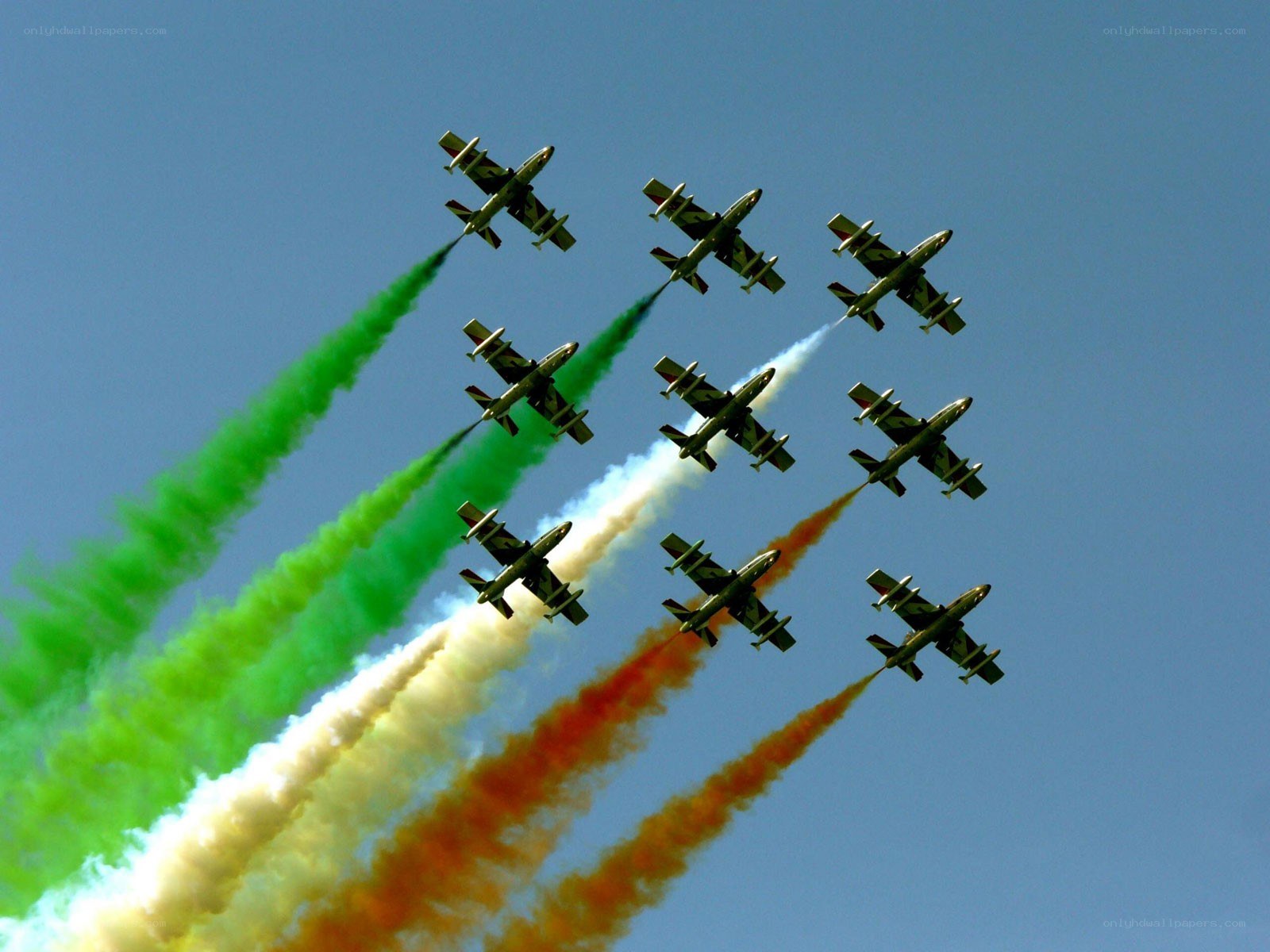 airplane formation with colored smoke