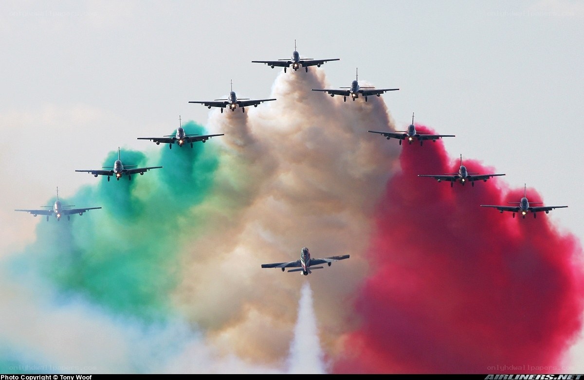Airplane formation with colored smoke