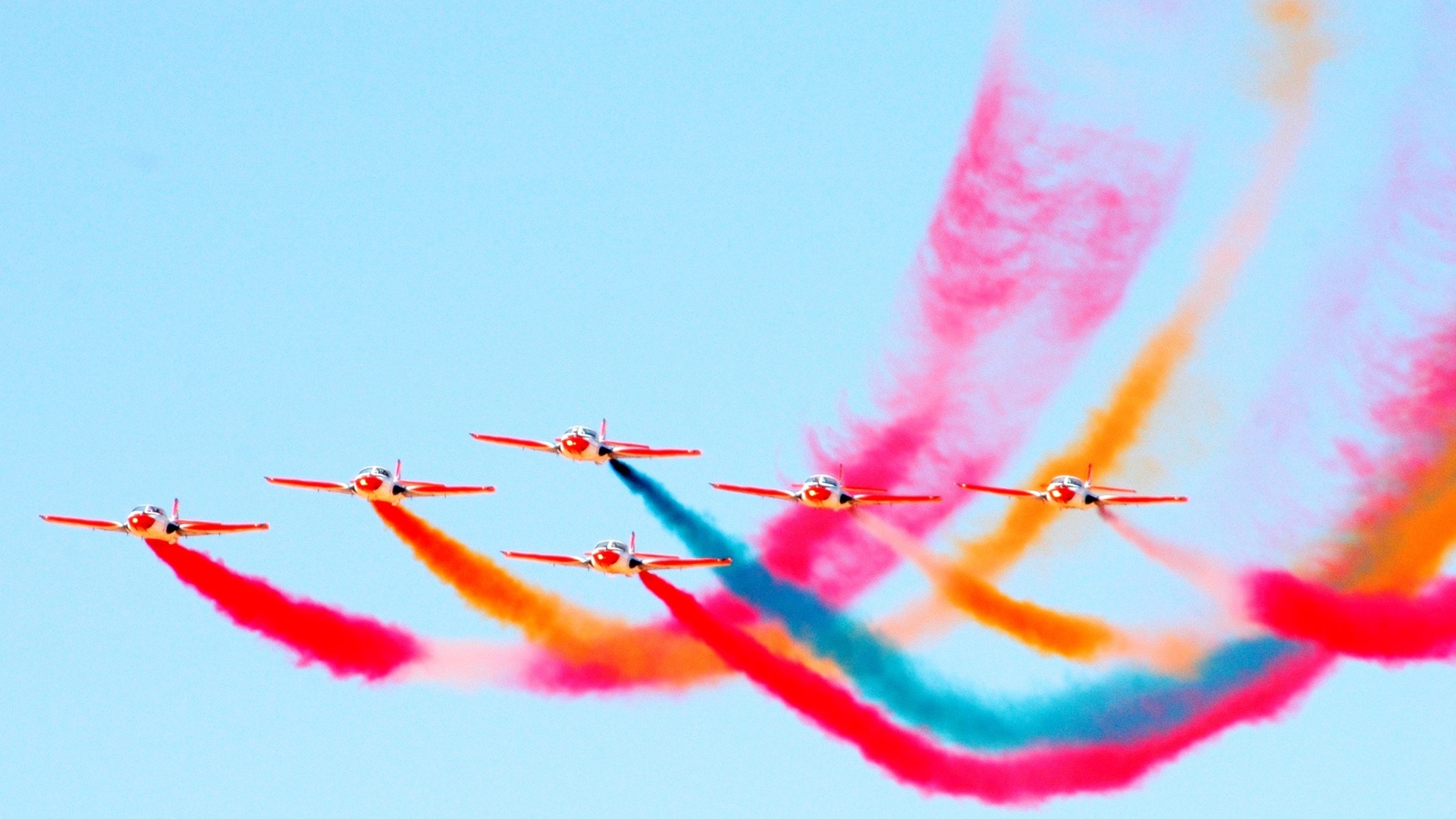 airplane formation with colored smoke