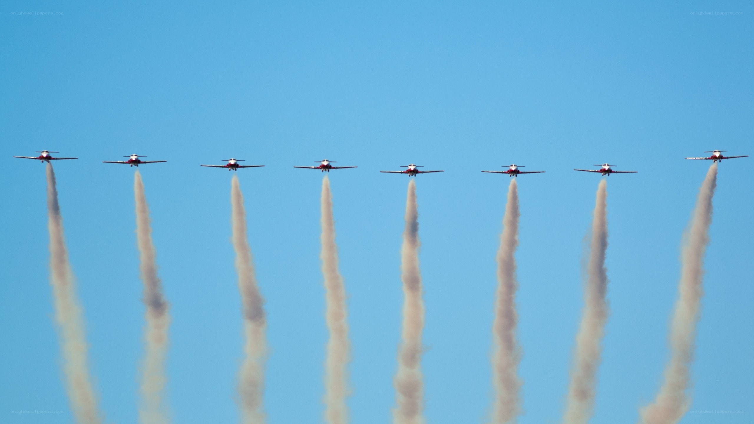 airplane formation with smoke trails