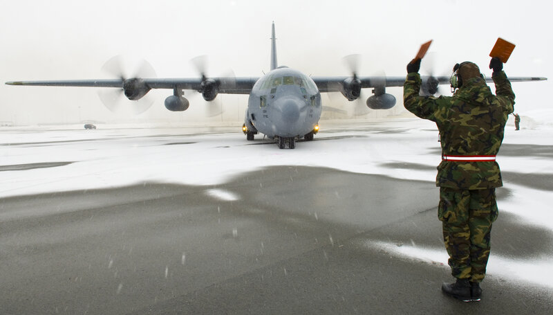 Airplane ground crew in snow