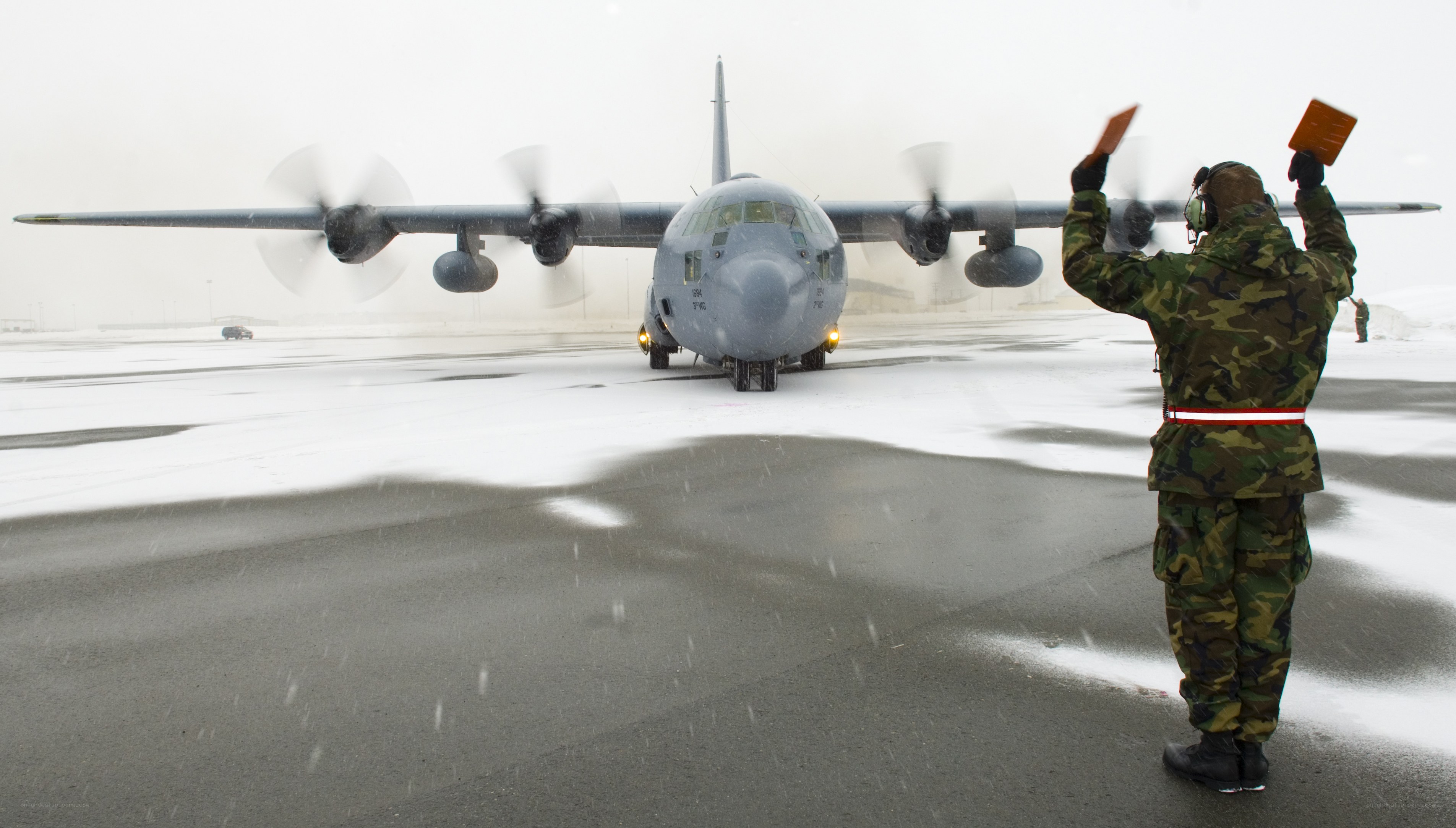 Airplane ground crew in snow