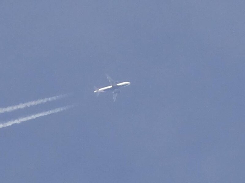 Airplane in Blue Sky — Calm
