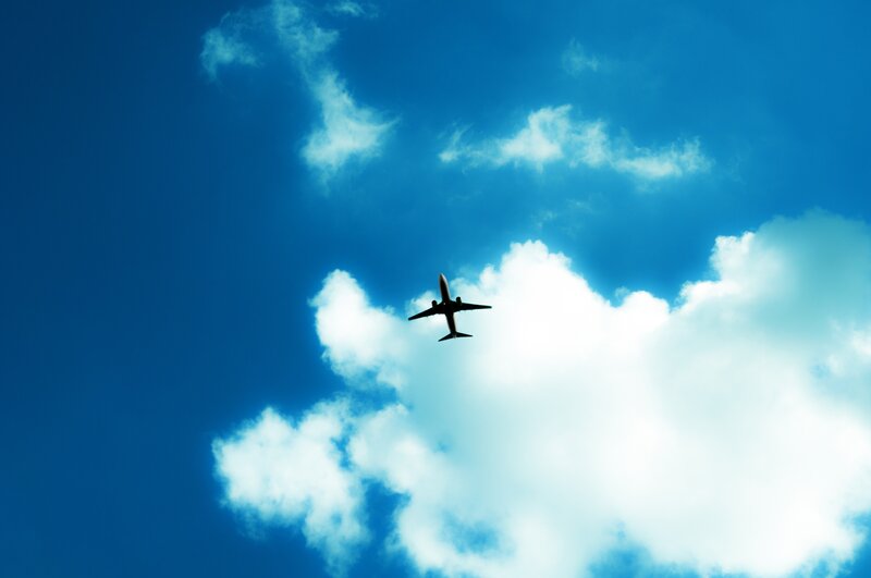 Airplane in Blue Sky — Photograph