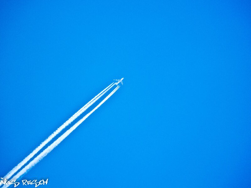 Airplane in Blue Sky — Serene, Afternoon, Photograph, Contrails, White