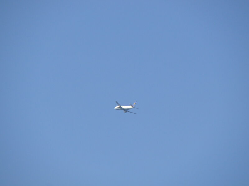 Airplane in Blue Sky — Serene