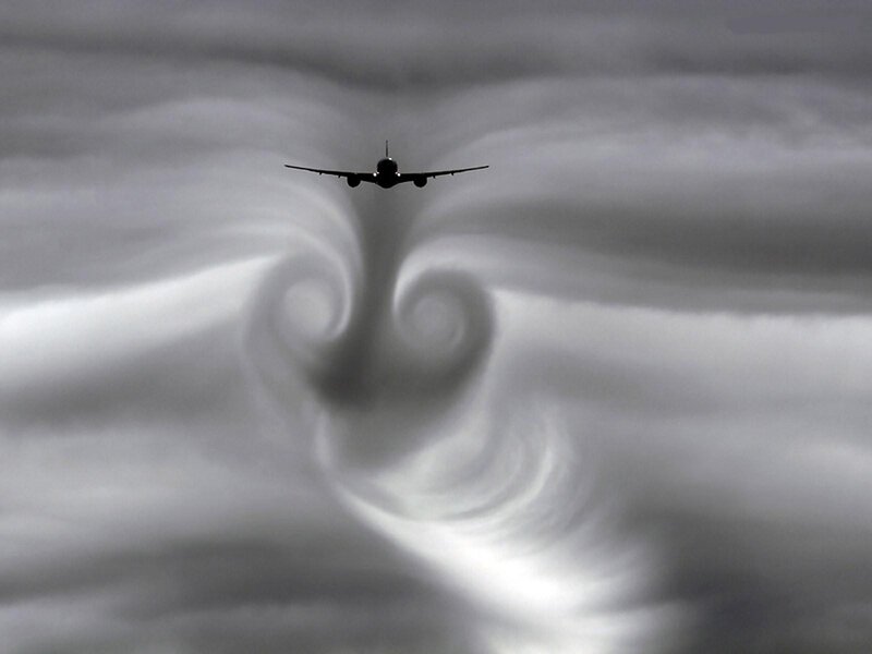 Airplane in Clouds — Gray, Dramatic, Photograph