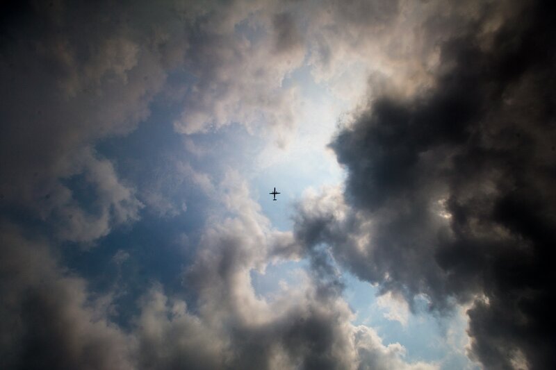 Airplane in Cloudy Sky — Blue, Dramatic, Afternoon, Photograph, Clouds