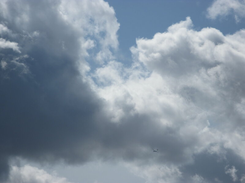 Airplane in Cloudy Sky — Blue, Dramatic, Afternoon