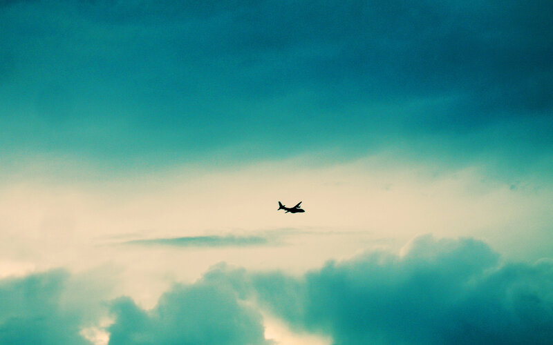 Airplane in Cloudy Sky — Blue, Dramatic, Sunset