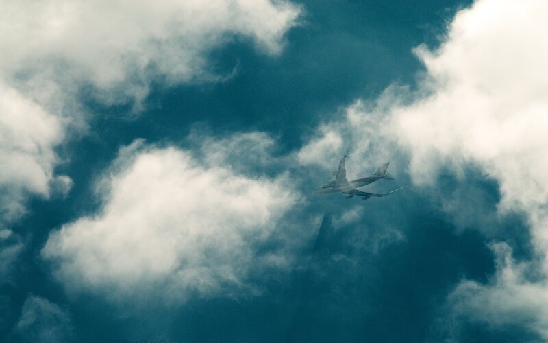 Airplane in Cloudy Sky — Clouds