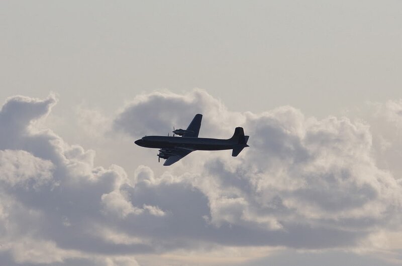 Airplane in Cloudy Sky — Gray, Calm