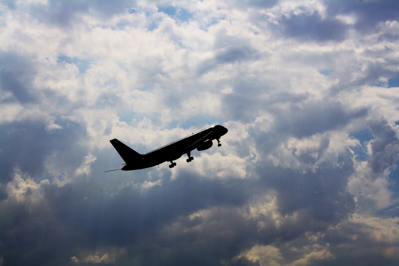 Airplane in cloudy sky