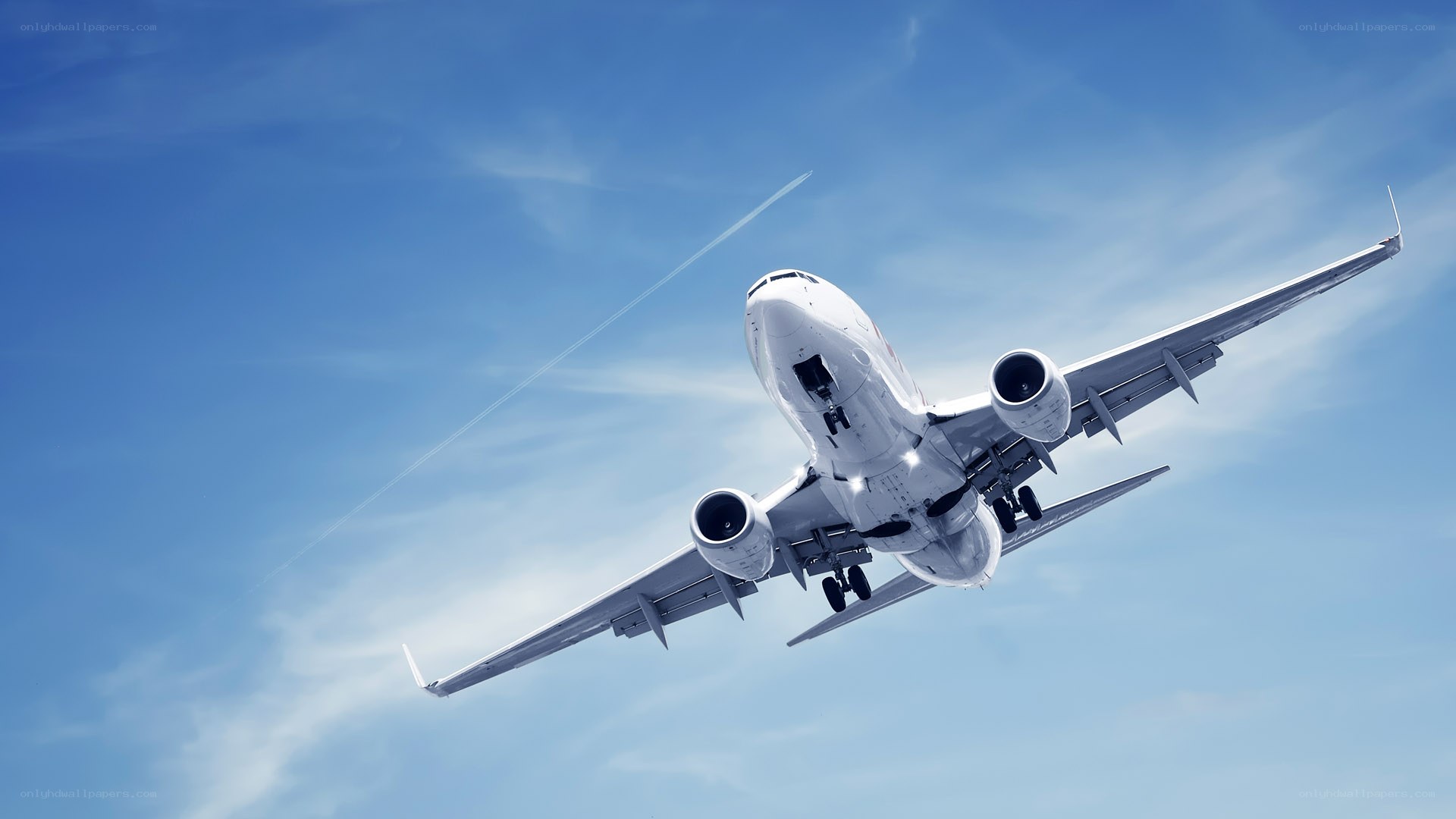 Airplane in flight against blue sky