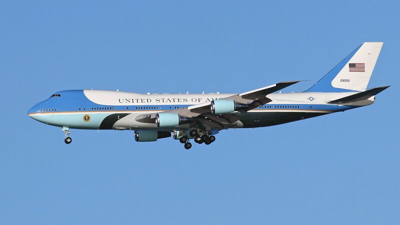 Airplane in Flight — Blue, Calm, Afternoon, Photograph, American Flag