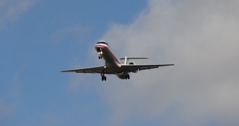 Airplane in Flight — Blue, Calm, Afternoon, Photograph, Sky, Clouds, Landing Gear