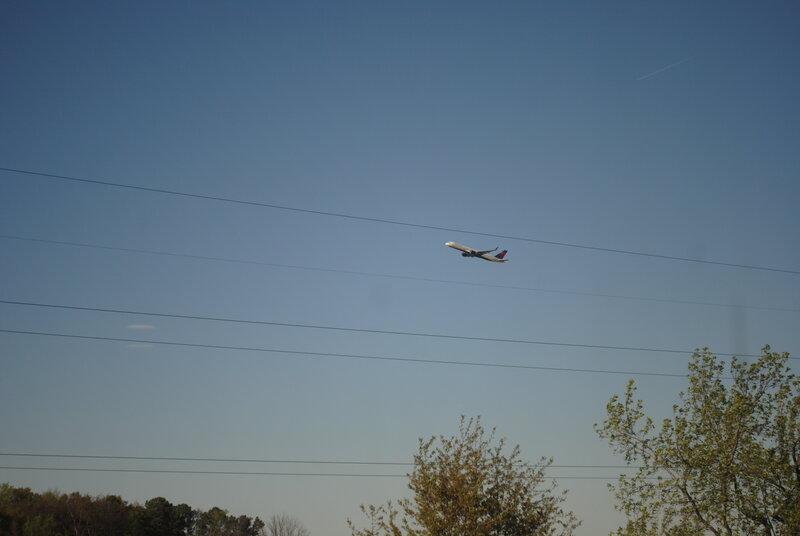 Airplane in Flight — Blue, Calm, Afternoon