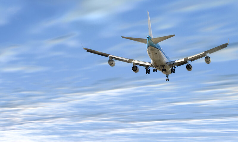 Airplane in Flight — Blue, Calm, Morning