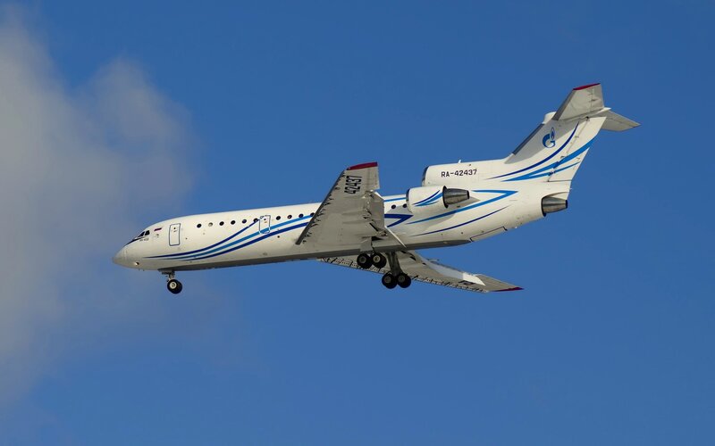 Airplane in Flight — Blue, Clear, Afternoon, Photograph, Sky, Clouds, Landing Gear