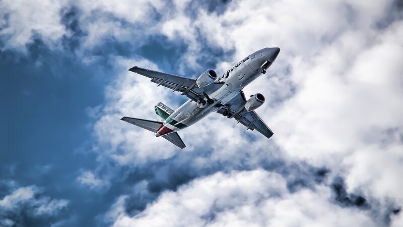 Airplane in Flight — Blue, Dramatic, Photograph, Clouds